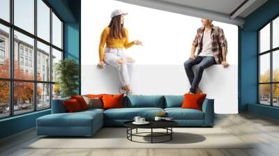 College students sitting on a panel and having a conversation Wall mural