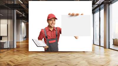 Delivery guy holding a clipboard and a blank card Wall mural