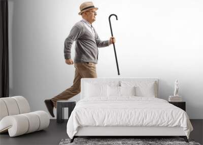 Elderly man running and holding a walking cane Wall mural