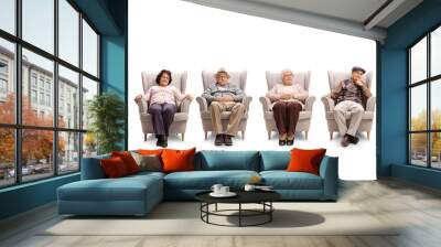 Elderly men and women sitting in armchair and looking at the camera Wall mural