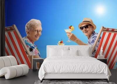 Elderly tourists with cocktails Wall mural