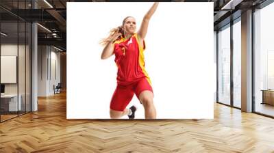 Female basketball player jumping with a ball Wall mural