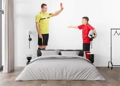 Football referee showing red card to a boy Wall mural