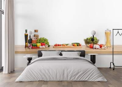 Fresh vegetables and a cutting board on a wooden kitchen counter Wall mural