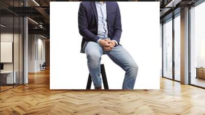 Full length portrait of a man in a suit and jeans sitting on a bar chair Wall mural