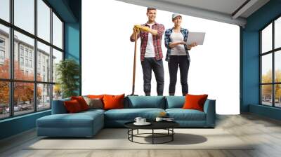 Full length portrait of modern farmers, male and female with a laptop computer Wall mural