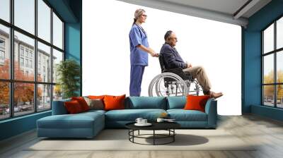 Full length profile shot of a female health care worker with a mature man in a wheelchair Wall mural