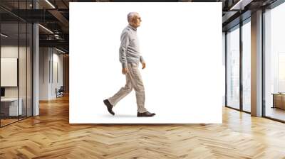 Full length profile shot of a mature gentleman walking Wall mural