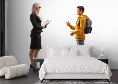 Full length profile shot of a teenage male student talking to a businesswoman Wall mural