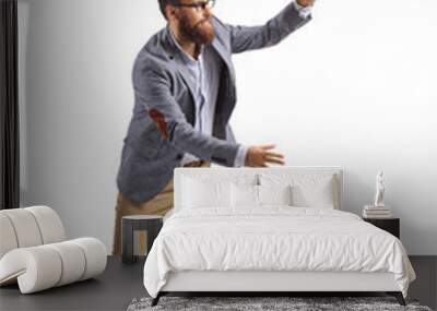 Full length shot of a cheerful bearded man trying to catch something Wall mural