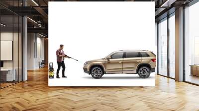 Full length shot of a man cleaning a suv with a pressure washer machine Wall mural