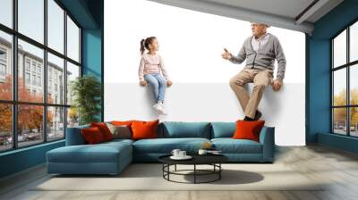 Gentleman sitting on a blank panel and talking to a child Wall mural