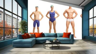 Group of causal people swimmers, young and older in swimming suits, googles and caps Wall mural