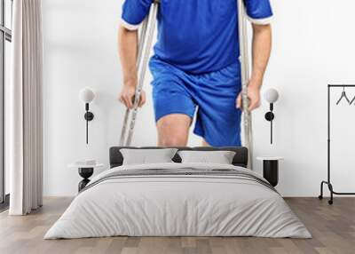 Injured soccer football player on crutches Wall mural