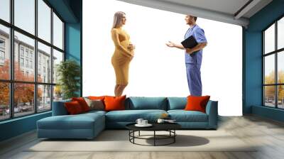 Male doctor talking to a pregnant woman in a yellow dress Wall mural