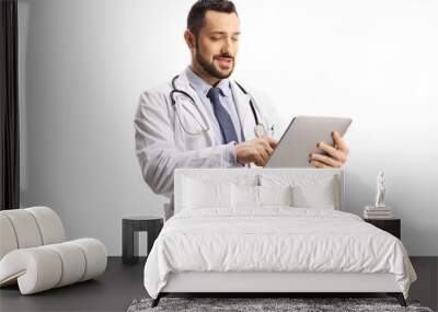 Male doctor using a digital tablet Wall mural