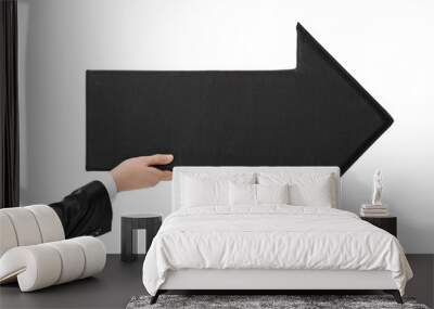 Male hand holding a big black arrow pointing right Wall mural