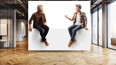 Male teen student sitting on a blank panel and talking to a bearded guy Wall mural