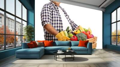 Mature farmer holding a crate full of fresh organic vegetables Wall mural