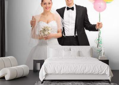 Newlywed couple holding balloons Wall mural