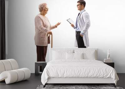 Old lady with a cane talking to a young male doctor Wall mural