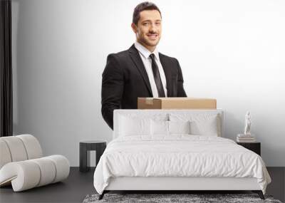 Professional man in a suit holding a cardboard box Wall mural