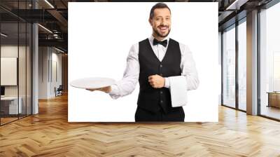 Professional waiter holding an empty plate and smiling Wall mural