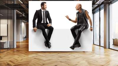 Punker and a businessman sitting on a panel and having a conversation Wall mural