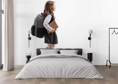 Schoolgirl with a backpack walking Wall mural