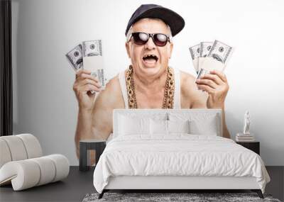 Senior in hip hop outfit holding a few stacks of money Wall mural