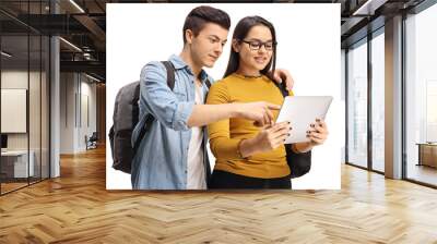 Teenage students looking at a tablet Wall mural