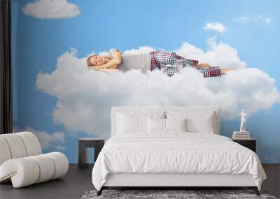 Tranquil scene of a woman sleeping on cloud Wall mural