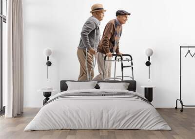 Two elderly men walking with crutches and walker Wall mural