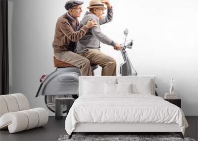 two senior men riding a vintage scooter fast Wall mural