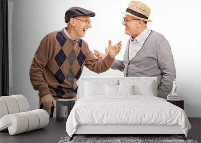 Two senior men talking to each other and laughing Wall mural