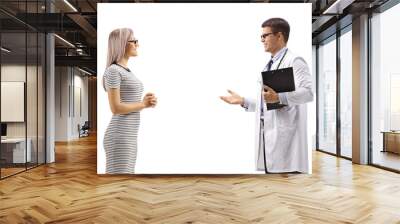 Young female patient and a doctor talking Wall mural