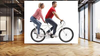 Young man and woman riding a tandem bicycle Wall mural