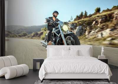 Young man riding a motorbike Wall mural