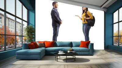 Young man talking with a female student gesturing with hand Wall mural