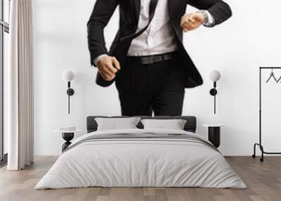 Young professional man in a suit running late Wall mural