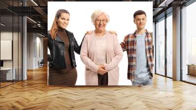 Young woman and a male student standing next to an older lady Wall mural