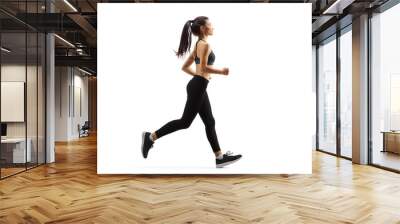 Young woman jogging Wall mural