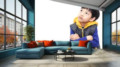 Child looking up isolated on white background. Little boy thinking and contemplates isolated on white background. Wall mural