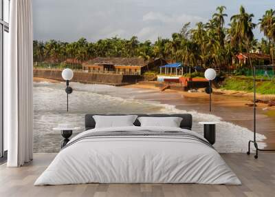  Waves crashing on the Sinquerim fort with the beach landscape in the background in Goa Wall mural