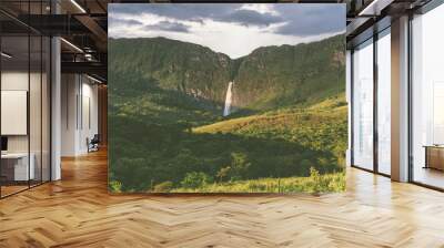 A dense waterfall in a amazing tropical forest with a big canyon in Serra da Canastra National Park in Minas Gerais, Brazil Wall mural