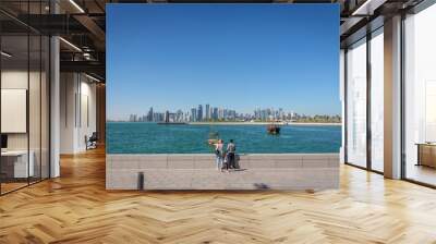 Doha, Qatar - Jan 9th 2018 - Locals and Residents enjoying a open area in Doha, public space, blue sky, in Doha, Qatar Wall mural