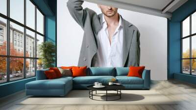 Fashion man model in grey suit, shoot in studio Wall mural