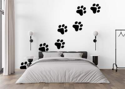 Vector high quality illustration of paw prints silhouette making a path on the ground - isolated on white background Wall mural