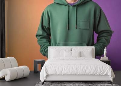 Green hoodie with a pocket on a colorful background. Wall mural