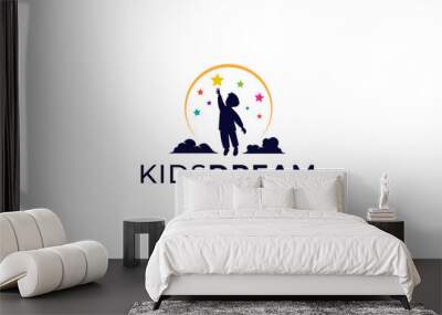 vector design logo of a silhouette of a boy reaching for a colorful star on a moon and clouds background Wall mural